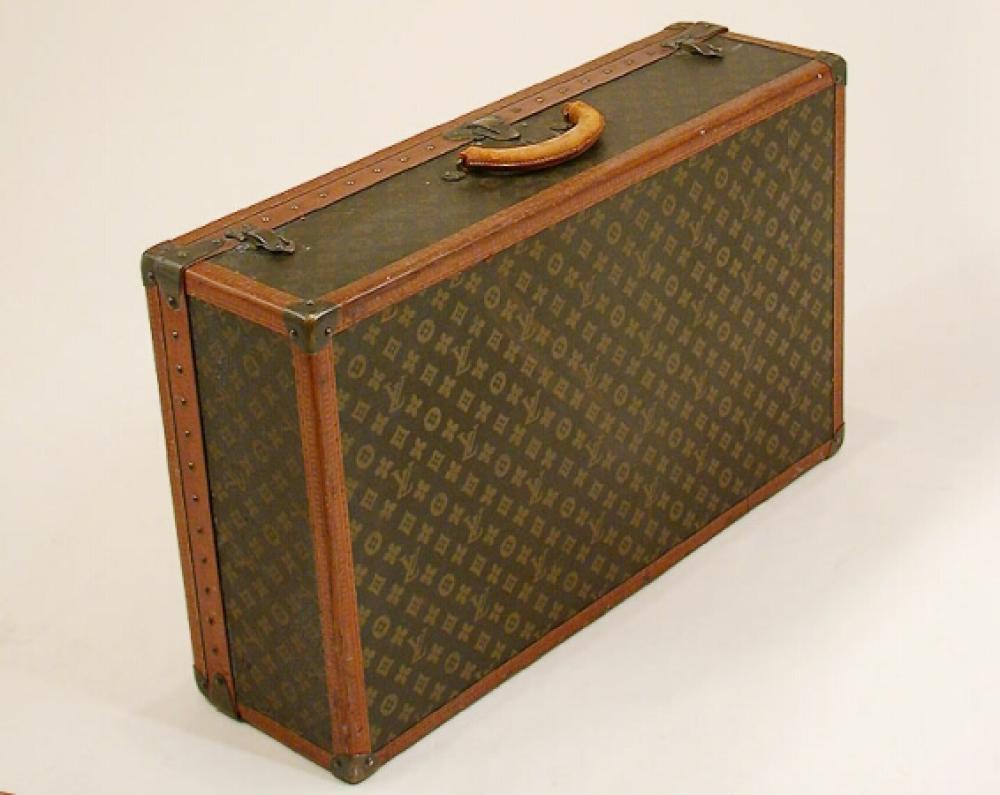 Louis Vuitton Suitcase

Lot 1000
Louis Vuitton Suitcase
 1950s 
 Monogram canvas, LV stamped leather trim, brass corners, rolled leather handle, lock number 106083, stenciled in red on right side VHG, Rosemont, PA, linen interior, top tray with straps, 18 1/2 x 29 3/4 x 8 3/4 inches, interior labels: Louis Vuitton/Paris/70 Champs-Elysees/149 New Bond St./London/Nice/2 Jardin Alber/Vichy/Rue du Parc, No. 811240/Bought From John Wanamaker/New York/ Philadelphia.
Good condition, some wear to handle.