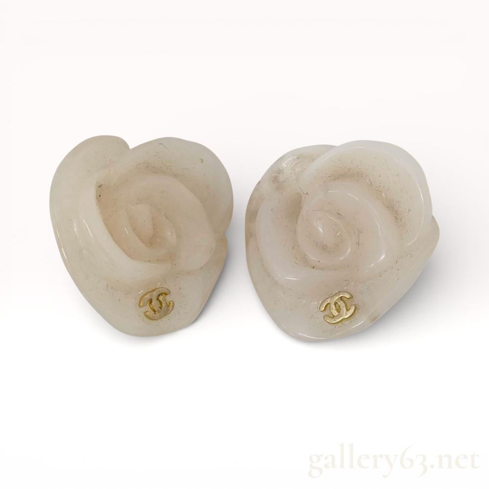 Description
Authentic Chanel camellia motif earrings formed in molded translucent plastic, presenting sculptural floral shapes with softly rounded petals. Each earring set with a small gold-tone interlocking CC emblem at the base of the flower. Clip-on backs fitted with gold-tone hardware. Design reflects Chanelâs iconic camellia theme with a lightweight, statement scale.