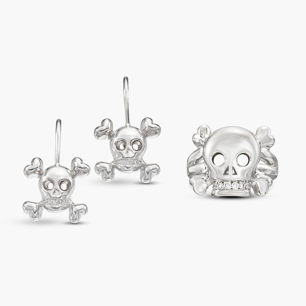 Dior

Comprising: a ring designed as a skull, brilliant-cut diamond set teeth; and a pair of earrings en suite.