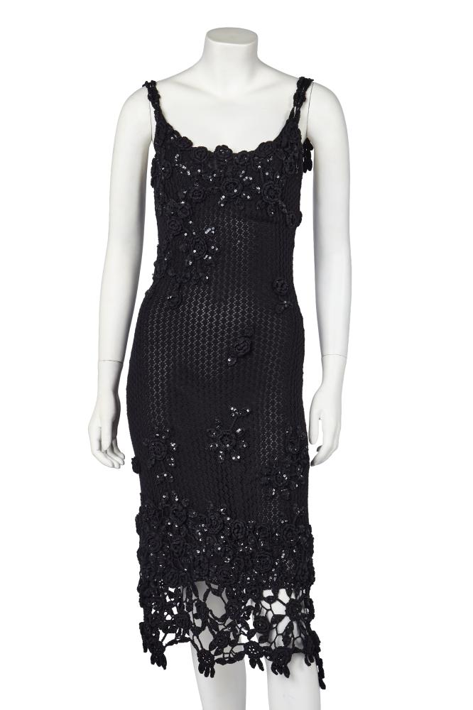 A Moschino embellished black knitted midi dress, 2000s

A Moschino embellished black knitted midi dress, 2000s

Cheap and Chic label, the dress of open knit cotton, with sequined crochet rosette appliqués graduating inwards from neckline and hem, bust approx 76cm 30in; with a black crêpe georgette slip (2)

Share this lot: