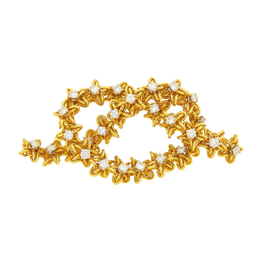 Property of a Distinguished Lady from Athens, Greece18 kt., 25 round diamonds ap. 1.60 cts., signed VCA, Made in France, no. 1V883-1, ’66’, ap. 15 dwts.

Diamonds: G-H-I-VS.2 5/8 x 1 1/4 inches.                            
Any condition statement is given as a courtesy to a client, is an opinion and should not be treated as a statement of fact and our Organization shall have no responsibility for any error or omission. Please contact the specialist department to request further information or additional images that may be available.