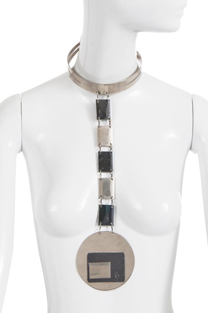 A Pierre Cardin choker necklace, 1969

A Pierre Cardin choker necklace, 1969

signed to the inside medallion ’Pierre Cardin, Made in France’, the choker suspending a platelet chain and circular medallion with layered rectangles, length 34cm 13in

Share this lot: