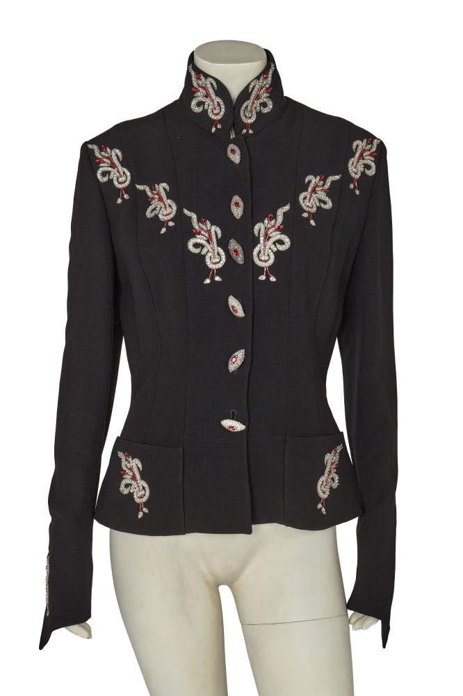 A Karl Lagerfeld embellished black jacket, 1990s

A Karl Lagerfeld embellished black jacket, 1990s

labelled, size 40, with aigrette motifs embroidered in metallic silver threads and further embellished with clear and pink beads and rhinestones, with similarly decorated eye-shaped buttons centred with pink rhinestones, stand collar, contour darts, patch pockets, bust 102cm 40in

Share this lot:
