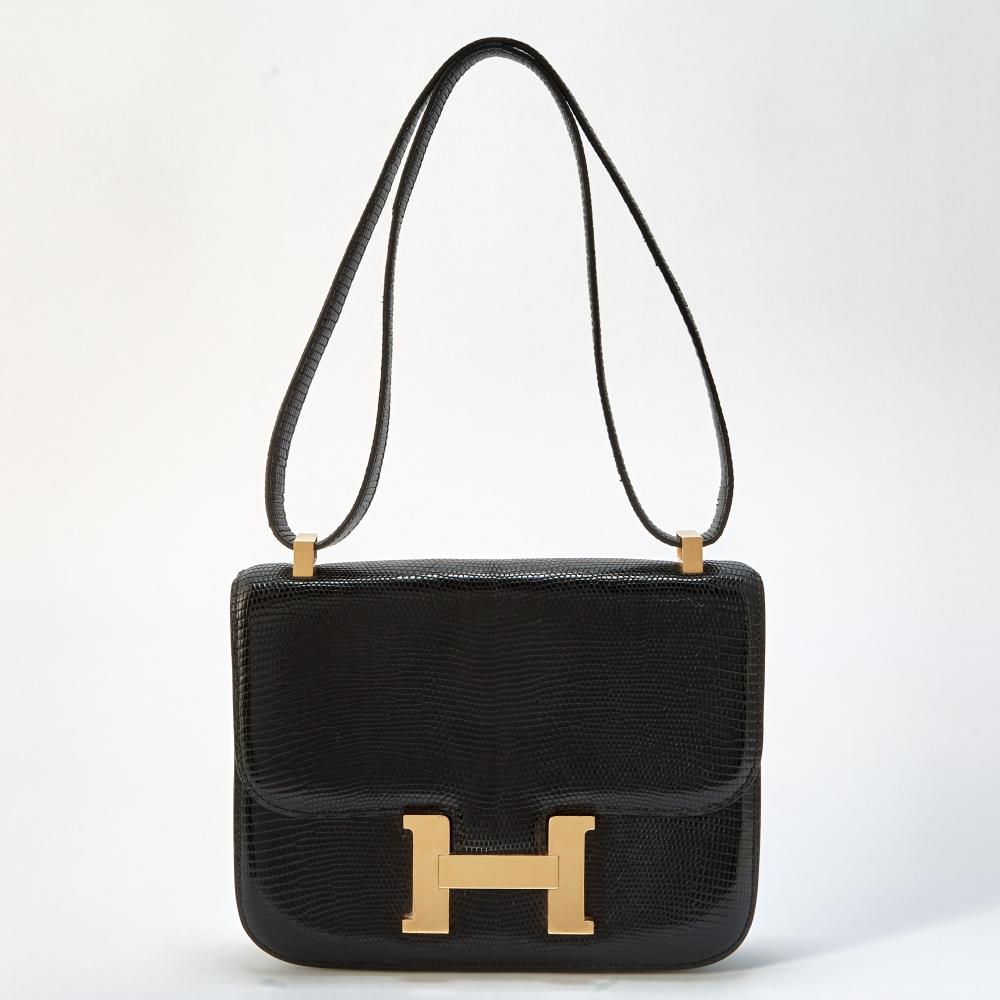 From a Private CollectionShoulder bag with gold-tone ’H’ magnetic closure, front flap opening to a smooth black leather interior with one side zippered pocket and one side slip pocket, signed Hermès. 8 3/4 x 7 x 1 1/2 inches.

Moderate wear. Some creasing to strap, minor scuffing on bottom corners. Light scratches to hardware.                            
Any condition statement is given as a courtesy to a client, is an opinion and should not be treated as a statement of fact and our Organization shall have no responsibility for any error or omission. Please contact the specialist department to request further information or additional images that may be available.