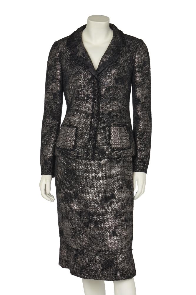 A Prada black and silver wool suit, 2006

A Prada black and silver wool suit, 2006

labelled, of silver-coated black wool, the jacket with ruched black trim to collar and lapels, with patch pockets, snap and hook and loop closure, bust 96cm 38in; the matching skirt with pleated black ribbon to waist, pleated hem, waist 71cm 28in (2)

Share this lot:
