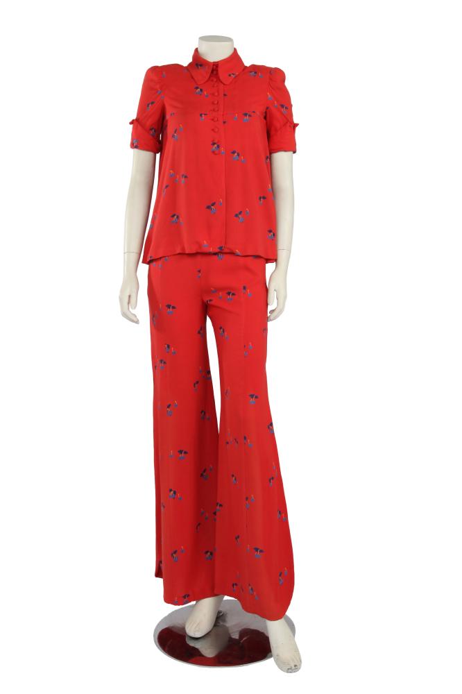 A Biba printed red viscose ensemble, circa 1970

A Biba printed red viscose ensemble, circa 1970

woven art nouveau label, printed with blue cherries, the swing-cut blouse with padded shoulders, short sleeves, angled collar, buttons to front, bust 81cm 32in; the matching flared trousers with high slits to hem sides, waist 71cm 28in (2)

Share this lot: