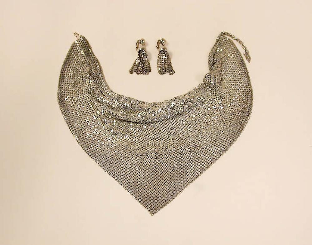 Whiting and Davis Silver Mesh Suite

Lot 903
Whiting and Davis Silver Mesh Suite
 American 
 Comprising a metal mesh triangular bib and matching drop earrings, signed: Whiting and Davis.
Excellent condition. 
 Plaza Art Galleries, New York, Estate of Joan Crawford Costume Jewelry, January 19, 1978, lot 423.