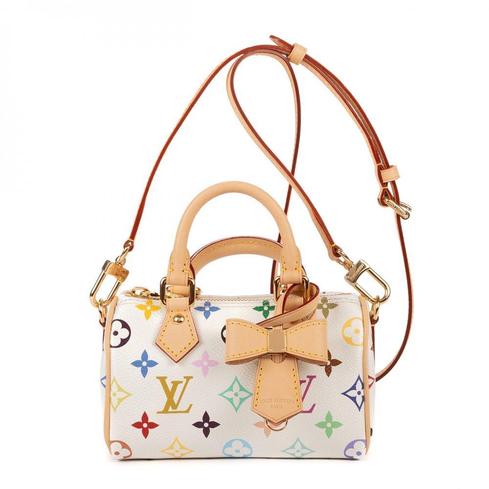 Description

LOUIS VUITTON.
LV x Takashi Murakami Nano Speedy limited edition bag.
Made in white canvas with the Louis Vuitton Multicolore monogram, characteristic of the collaboration with the artist Takashi Murakami. Short handles to carry in hand in vachetta leather. Zipper closure at top. Gold hardware.
Includes its box and cloth bag to protect it from dust, a clochette in the shape of a bow and a detachable and adjustable vachetta leather strap with buckles.
With identification chip.
Measurements: 16 x 10 x 7,5 cm.

The Louis Vuitton x Takashi Murakami collection, launched in 2003, marked a before and after by fusing luxury with contemporary art. Murakami reinterpreted the brand’s classic monogram with bright colors and motifs such as flowers and cherries, giving it a more youthful and pop air.