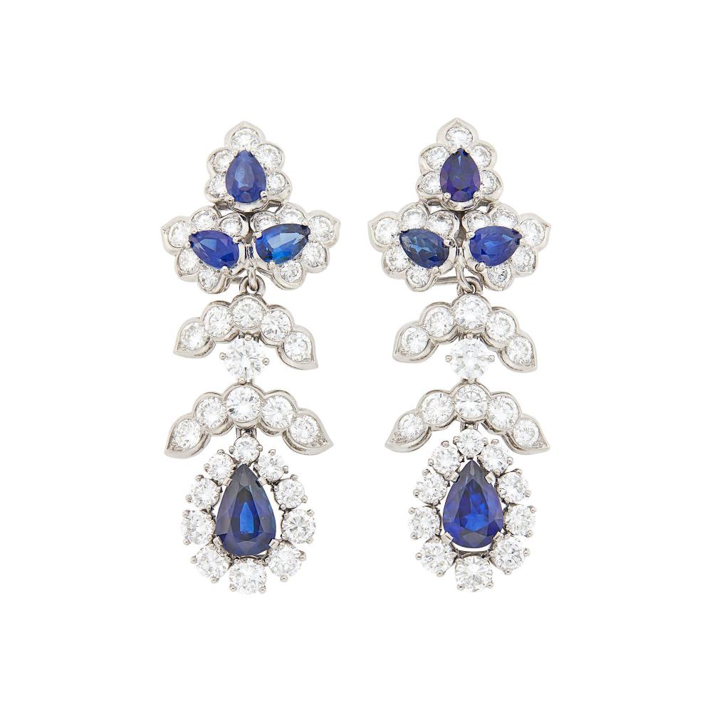Collection of a Vero Beach Lady18 kt., 6 pear-shaped sapphires ap. 2.50 cts., 2 pear-shaped sapphires ap. 3.00 cts., 62 round diamonds ap. 6.50 cts., signed Tiffany & Co., ap. 14.4 dwts.
 
Please note that the tops are 18 kt. and the pendants are platinum.

Sapphires: deep blue, cleanish to slightly included, lively.Diamonds: G-H-VS.Move well. Screw-backs. 2 x 3/4 inches.                            
Any condition statement is given as a courtesy to a client, is an opinion and should not be treated as a statement of fact and our Organization shall have no responsibility for any error or omission. Please contact the specialist department to request further information or additional images that may be available.