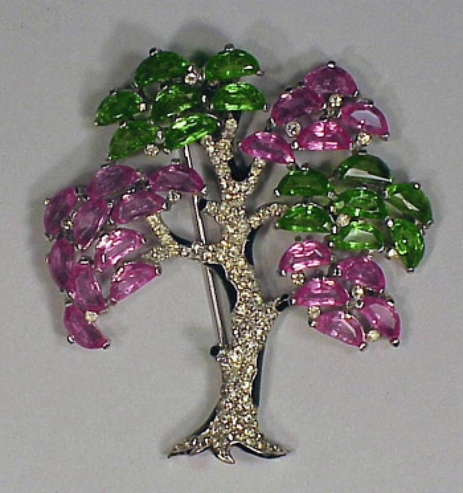 Alfred Phillipe for Trifari

Lot 160
Alfred Phillipe for Trifari
 Partially painted with rhinestones and pink and green crystal stones, circa 1940.