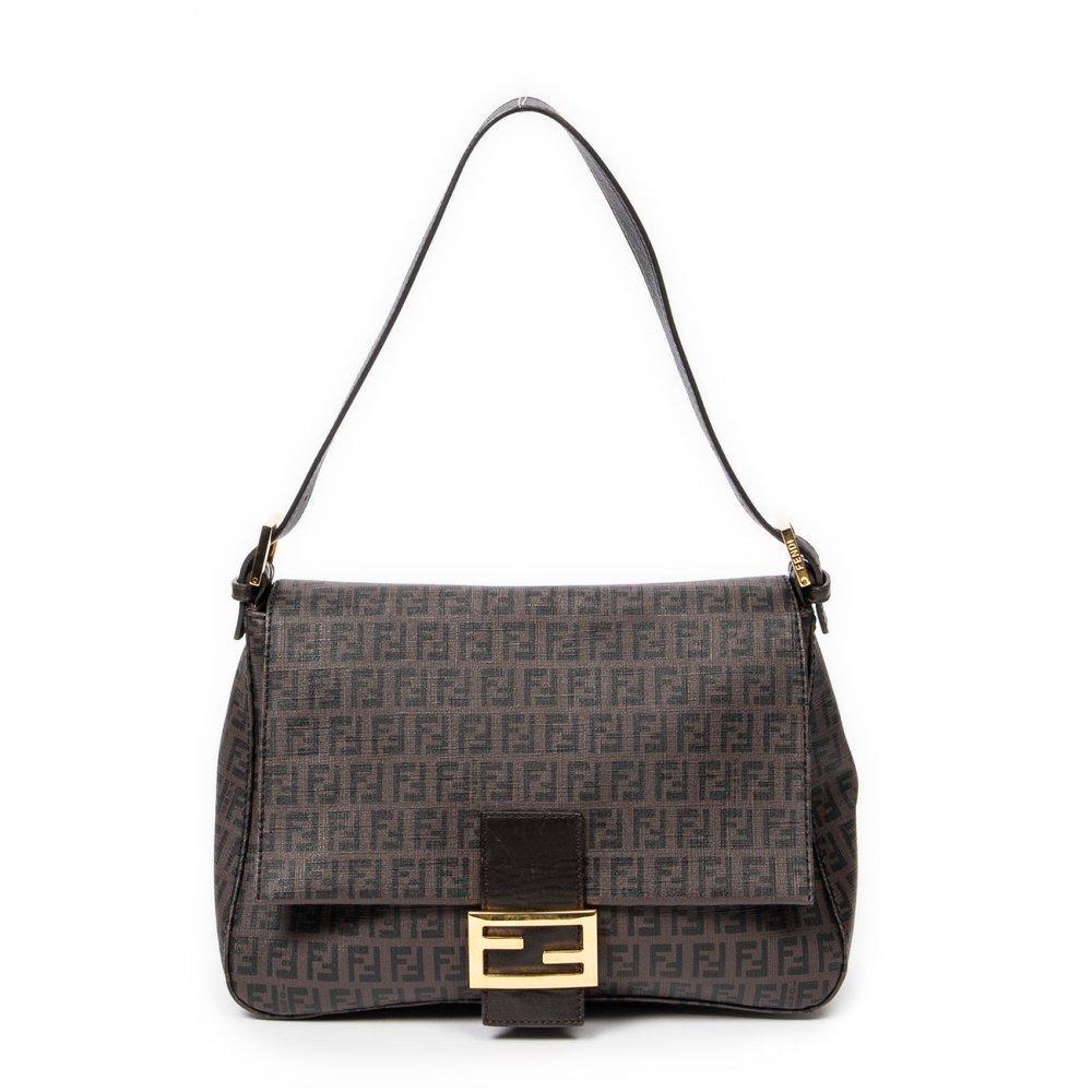 Description

FENDI.
Mama Forever bag.
Dark brown Zucchino fabric. Brown leather details. Front flap with ribbon embellished with iconic gold-tone metallic FF logo. Short buckle adjustable shoulder strap.
With interior numbering.
In excellent condition, light signs of use.
Measurements: 28 x 19 x 11 cm.

In excellent condition, light signs of use.
