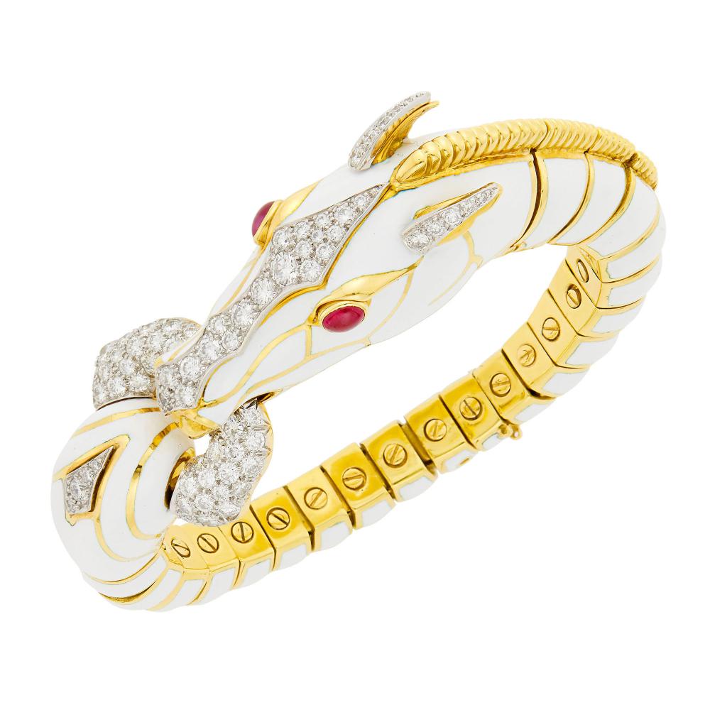 18 kt., 70 round diamonds ap. 3.95 cts., 2 oval cabochon ruby eyes, signed David Webb, no. BS218, safety clasp missing, ap. 89.6 dwts. Inner circle 6 1/2 inches.

Diamonds: G-H-VSRubies: medium deep slightly purplish to pinkish-red, cleanish to slightly included, translucent, very good polish.Safety clasp missing.Bracelet width 1 to 3/8 inch. Width of head 5/8 inch.                            
Any condition statement is given as a courtesy to a client, is an opinion and should not be treated as a statement of fact and our Organization shall have no responsibility for any error or omission. Please contact the specialist department to request further information or additional images that may be available.