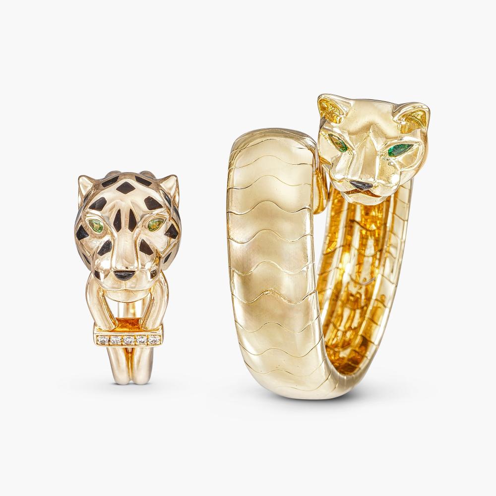 Cartier

The first ring designed as a panther’s head, set with pear-shaped emerald eyes and cabochon onyx nose; second ring of similar design, decorated with black lacquer spots, pear-shaped peridot eyes and cabochon onyx nose, highlighted with brilliant-cut diamonds.