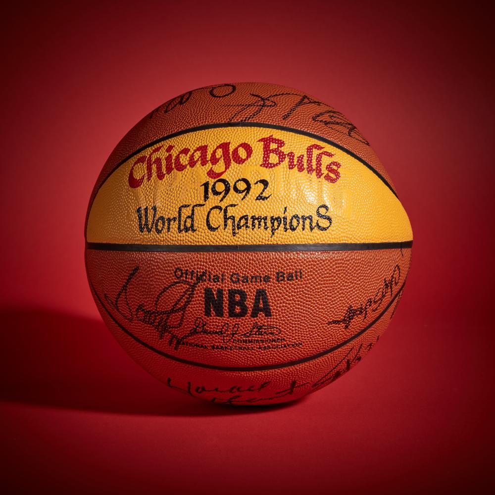 1992 Chicago Bulls ’World Champions’ Basketball | Signed by Scottie Pippen, Michael Jordan and Others

SPALDING BASKETBALL

Circa 1992

Offered in this lot is a basketball signed by members of the 1991–92 Chicago Bulls, with “Chicago Bulls 1992 World Champions” painted on the ball. Coming off their first NBA title, Chicago entered the season with heightened expectations and responded by setting a new standard. The Bulls finished the regular season at 67–15, the best record in the league, confirming that their breakthrough was no one-year surge.

At the core of that success were Michael Jordan and Scottie Pippen, whose partnership reached a new level during the season. Pippen continued to grow into one of the game’s most complete players, contributing across scoring, playmaking, and defense. Under the direction of head coach Phil Jackson, the triangle offense fully took shape and became one of the league’s most effective systems.

That control was evident throughout the year. Both Jordan and Pippen were named NBA All-Stars, and Jackson was selected to coach the Eastern Conference team after Chicago entered the All-Star break with the league’s top record. It was a clear midseason marker of a team operating with confidence and cohesion.

The playoffs only reinforced that standing. Chicago advanced through the Eastern Conference and met the Portland Trail Blazers in the NBA Finals. The Bulls prevailed in six games, securing their second straight championship and establishing themselves as the league’s standard.

Signed by members of the title-winning roster, this basketball represents the season when the Bulls confirmed that their first championship was not an endpoint, but the start of sustained dominance.

This ball was signed by Scottie Pippen, Michael Jordan, B.J. Armstrong, Bill Cartwright, Horace Grant, Bob Hansen, Craig Hodges, Dennis Hopson, Stacey King, Cliff Levingston, Chuck Nevitt, John Paxson, Will Perdue, Mark Randall, Rory Sparrow, and Scott Williams. This basketball comes directly from the Collection of Scottie Pippen.

The basketball is also accompanied by a letter from James Spence Authentication in regards to the signatures.