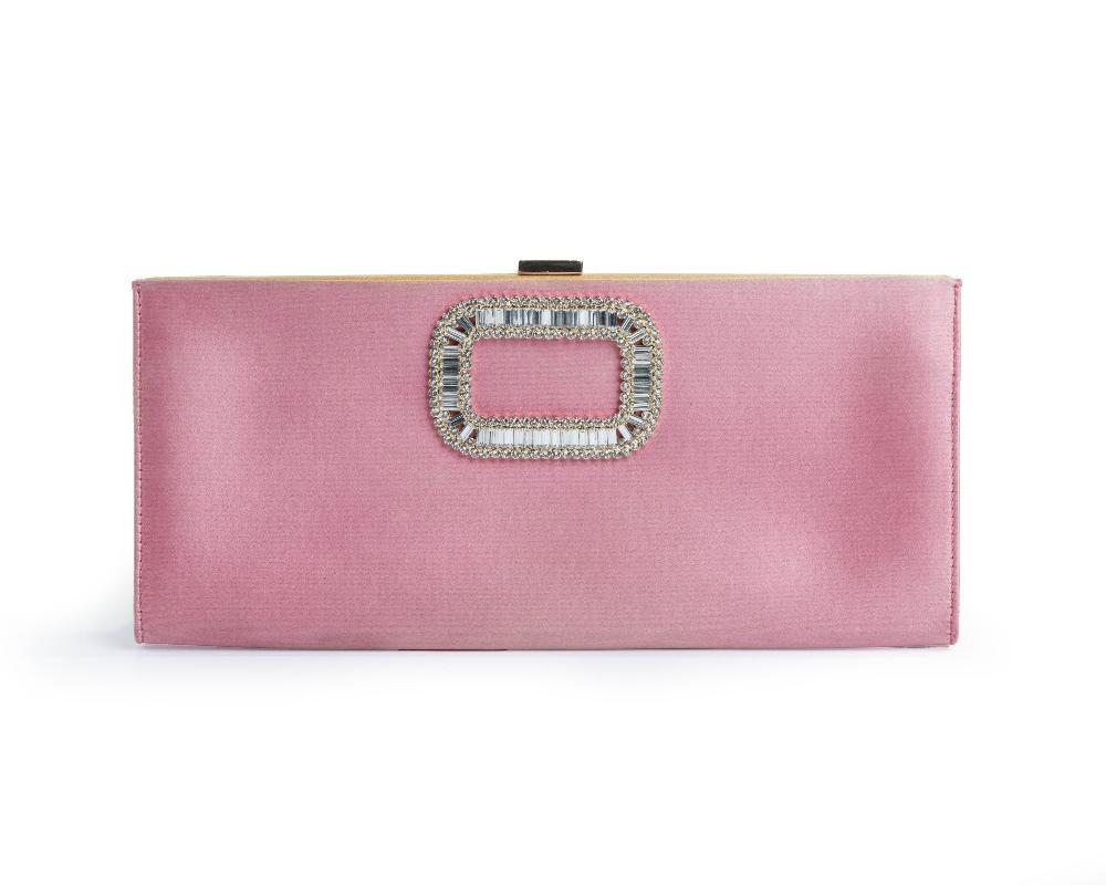 Description
Roger Vivier.

Pilgrim Buckle Clutch, of Rose Azalee satin on the exterior and cumin satin on the interior, with crystal-embellished buckle on the front and buckle closure, comes with the bag only

Width x Height x Depth: 27 x 12 x 1.5 cm 

Original runway value £1445

Artist or Maker
Roger Vivier
