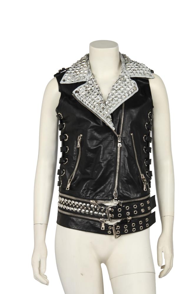 A Balmain by Christophe Decarnin black leather motorcycle vest, Spring-Summer 2011

A Balmain by Christophe Decarnin black leather motorcycle vest, Spring-Summer 2011

labelled, the white lapels studded with large pyramid studs, the sides with large grommets and black leather lacing, the detachable waistband/belt with further silver-tone studs, bust 86cm 34in

Share this lot: