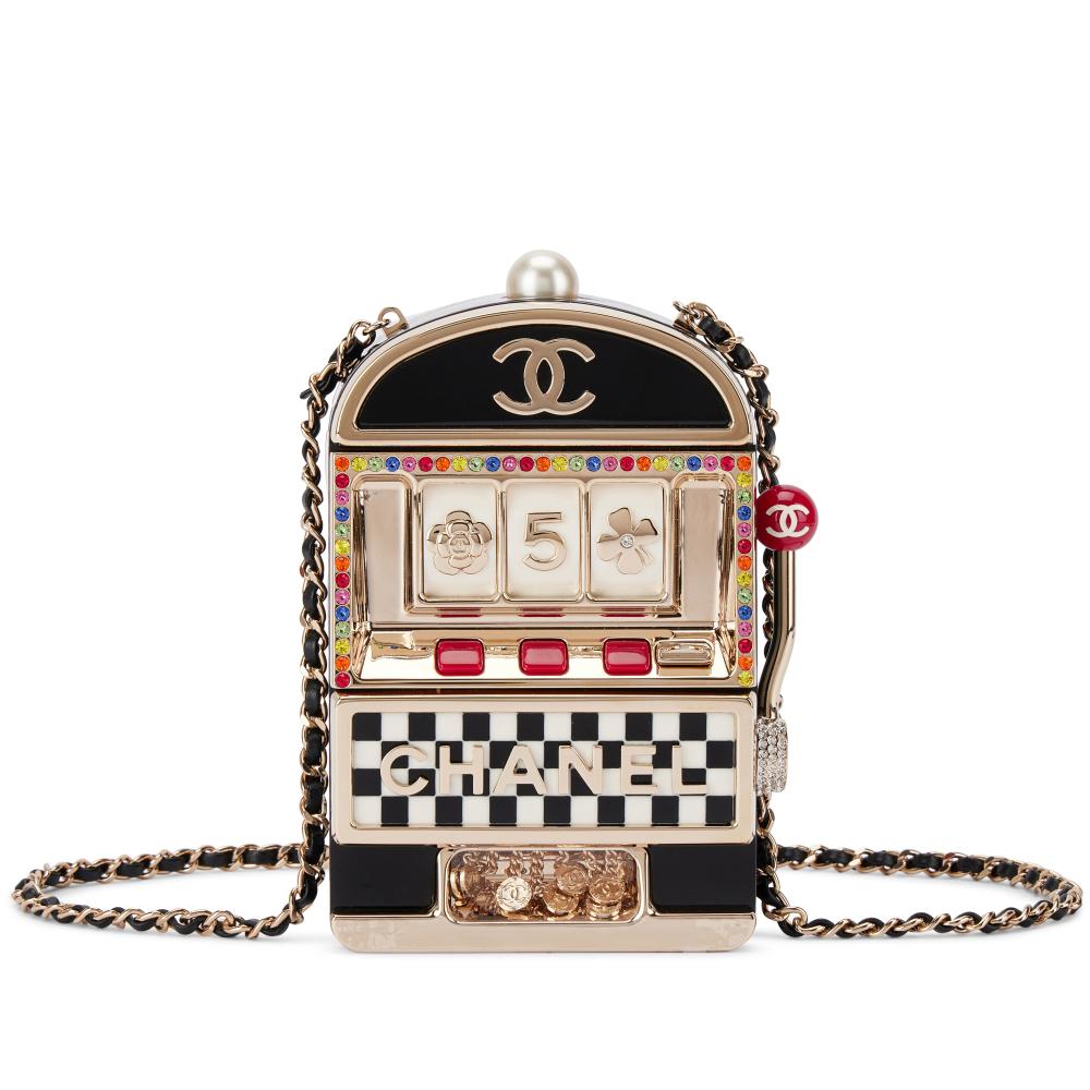 Chanel

Chanel Limited Edition Black, White, Red Lucite and Multicolor Crystal Slot Machine Minaudière Pale Gold and Imitation Pearl Hardware, 2023

香奈兒香限量版黑色拼白色、紅色樹脂及彩色水晶老虎機Minaudière手拿包，配淡金色金屬件拼仿珍珠，2023年

Please note that Condition 12 of the Conditions of Business for Buyers is not applicable to this lot.