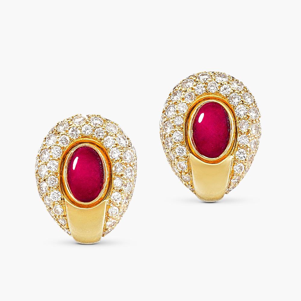 Cartier

Centring oval cabochon rubies, decorated with brilliant-cut diamonds.