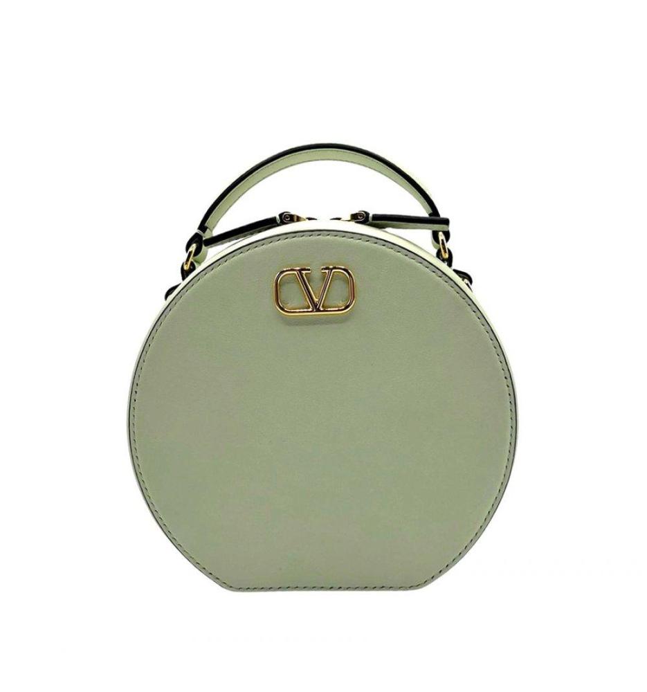 Description

VALENTINO GARAVANI.
Mini handbag.
Genuine leather in pastel lime green. Distinctive rounded design, accented by the iconic gold-tone metallic "V" logo, makes this an eye-catching yet refined piece.
The tone-on-tone leather-lined interior includes card slots, providing functionality without sacrificing style.
Includes original dust cover and Entrupy certificate of authenticity.
In a very good condition, showing little use and careful preservation.
Measurements: 15 x 16 x 6 cm.

This exclusive Valentino Garavani mini bag is a jewel of Italian design that combines elegance, sophistication and a contemporary style ideal for lovers of luxury fashion.

Valentino Garavani, a symbol of Italian luxury since the 1960s, is renowned for its clean lines and impeccable craftsmanship. This mini bag is a reflection of his timeless legacy and represents a smart investment in pre-owned luxury fashion.