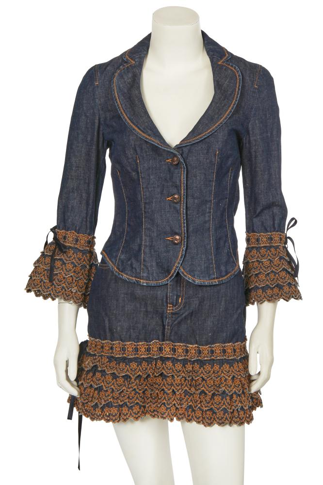 A Moschino by Rosella Jardini embroidered denim ensemble, 2000s

A Moschino by Rosella Jardini embroidered denim ensemble, 2000s

Moschino Jeans label, size 12, the blazer with frilly tiered broderie anglaise cuffs, brass buttons embossed with female busts, wide rounded lapels, bust 86cm 34in; the matching skirt with frilly tiered broderie anglaise hem, waist 81cm 32in (2)

Share this lot: