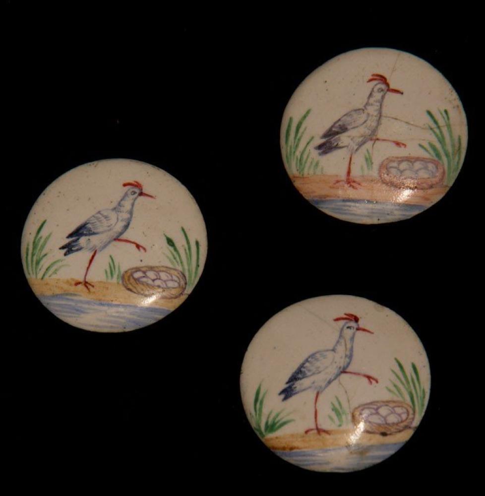 HAND PAINTED BUTTONS, LATE 19TH C

All round buttons: 1 set of 4 white porcelain, gilt edged & blue forget-me-not flowers w/ matching oval brooch; 1 set of 5 white china w/ raised motifs & gilt painted; 1 set of 3 white enamel on metal
