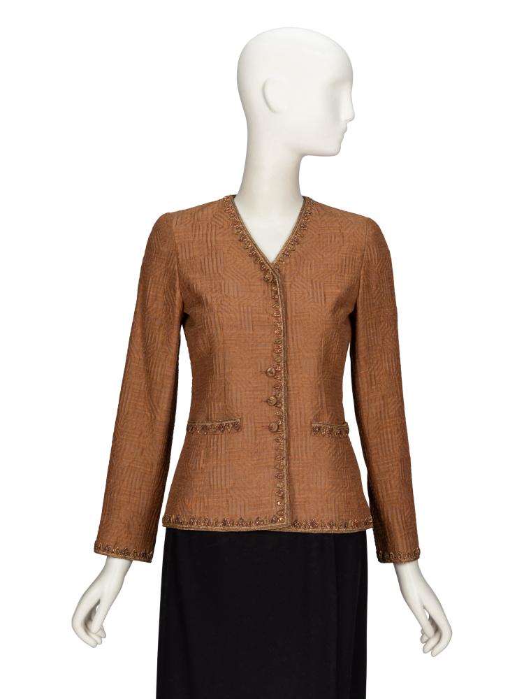 Balmain, Embellished Jacket

Balmain, Embellished Jacket



Tailored jacket in brown geometric-patterned jacquard with metallic gold & bronze embroidered embellishments throughout. Collarless V neckline. Light padding at shoulders. Wrist-length set-in sleeves. Two welt pockets at front. Fabric-covered button closures at front. Fully lined.

Label: Ivoire de Balmain
Size Label: 36
Style/Serial No.: Unmarked
Date: 1980’s - 1990’s
Country of Origin: France

Approximate Measurements:
Shoulders: 14“
Sleeve (center back neck to hem): 27.5“
Chest: 33“
Waist: 30“
Hips: 35“
Length (high shoulder point to hem): 24.5“


Property from the Collection of Phyllis and Fred Pressman

This lot is located in Chicago.