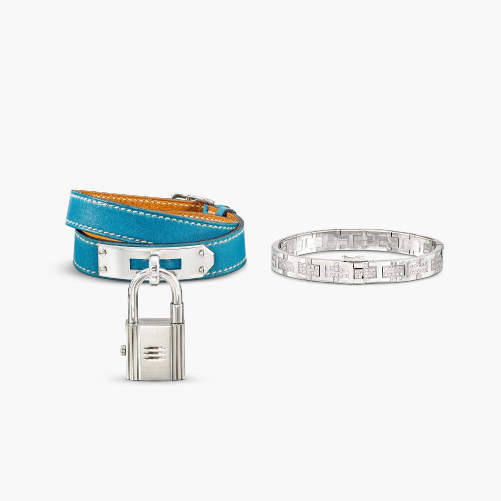 Hermès

The bracelet set with alphabet letter H motif, spaced by brilliant-cut diamonds; and a wristwatch suspending a padlock set with a rectangular dial, on a blue strap.