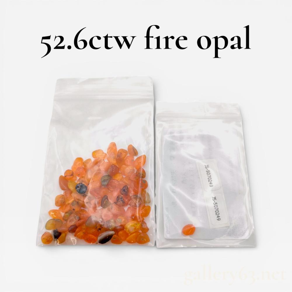 Description
This collection features a variety of natural fire opals in translucent orange, reddish-orange, and peach hues. The lot consists of numerous tumbled free-form stones and one individually bagged specimen accompanied by a Japan Gemstone Science Laboratory identification card. The certified stone, report number JS-5070249, is identified as a natural opal with noted signs of coloring.
Total weight: 52.6 ctw
Certified stone weight: 0.52 ct
Certified stone dimensions: 7.13 x 5.58 x 3.93 mm.