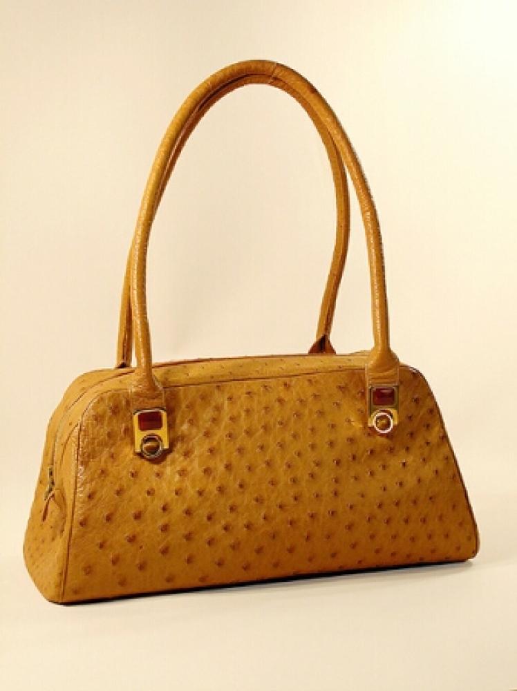 Judith Leiber Tan Ostrich Handbag

Lot 866
Judith Leiber Tan Ostrich Handbag
 Of rectangular shape with rounded sides and wide flat bottom, two self handles affixed with gilt-metal and tan toned semiprecious stones, 12 x 6 x 5 inches, labeled: Judith Leiber.
Very good condition, minor discoloration on base.