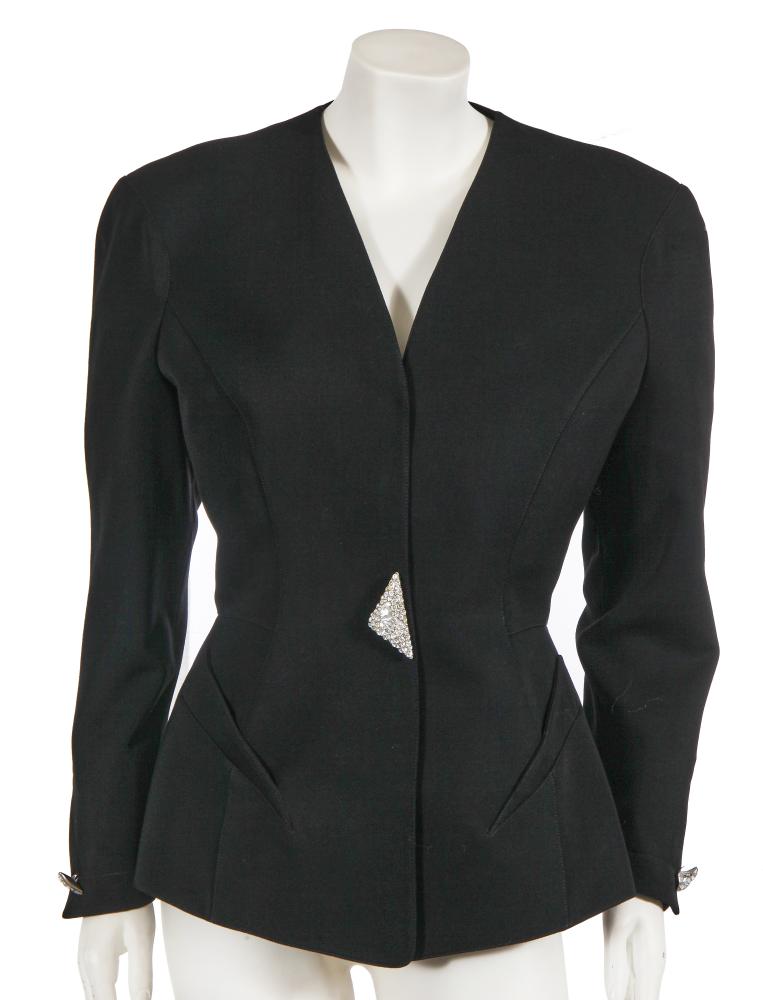 A Thierry Mugler black grain de poudre collarless jacket, circa 1992

A Thierry Mugler black grain de poudre collarless jacket, circa 1992

labelled, size 40, with large crystal-encrusted front snap cover, similarly adorned cuff buttons, slanted pockets, bust 102cm 40in

Share this lot: