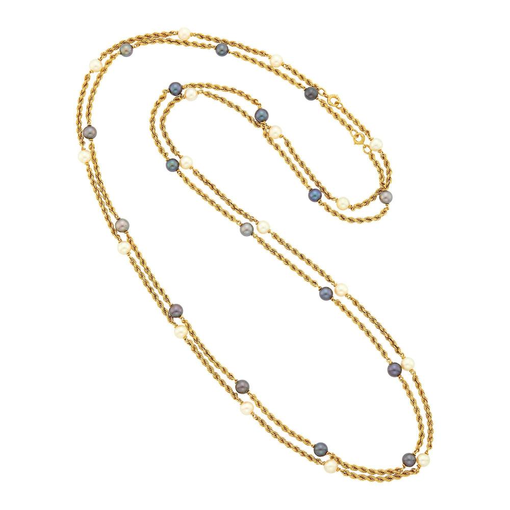Property of a Distinguished Lady from Athens, Greece18 kt., 34 white and black pearls ap. 6.6 to 6.4 mm., signed V.C.A., nos. B4044 P 60 and P 62, with French assay marks, ap. 46.4 dwts. gross. Lengths 33 inches.

Pearls: slightly creamy with rose and green orient, overall cleanish, minor bubble, charcoal gray with rose overtones to black with rose and green orient, cleanish, good luster.                            
Any condition statement is given as a courtesy to a client, is an opinion and should not be treated as a statement of fact and our Organization shall have no responsibility for any error or omission. Please contact the specialist department to request further information or additional images that may be available.