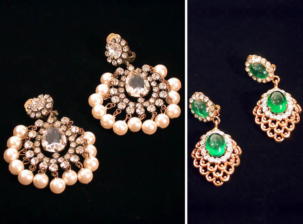 Group of Kenneth Jay Lane Pendant Earrings

Lot 920
Group of Kenneth Jay Lane Pendant Earrings
 The first with tear cut crystal surrounded by rhinestones and trimmed with faux pearl beads; the second of pink and green stones, diamante highlights and anatomic attachment; the last of lattice gilt-metal encircling faux emerald, all marked: KJL