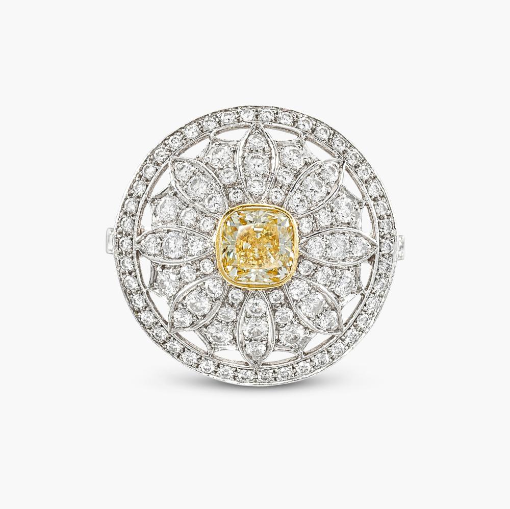 Tiffany & Co.

Designed as a stylised daisy, centring a cushion-shaped Fancy Yellow diamond weighing 0.49 carat, decorated with brilliant-cut diamonds.