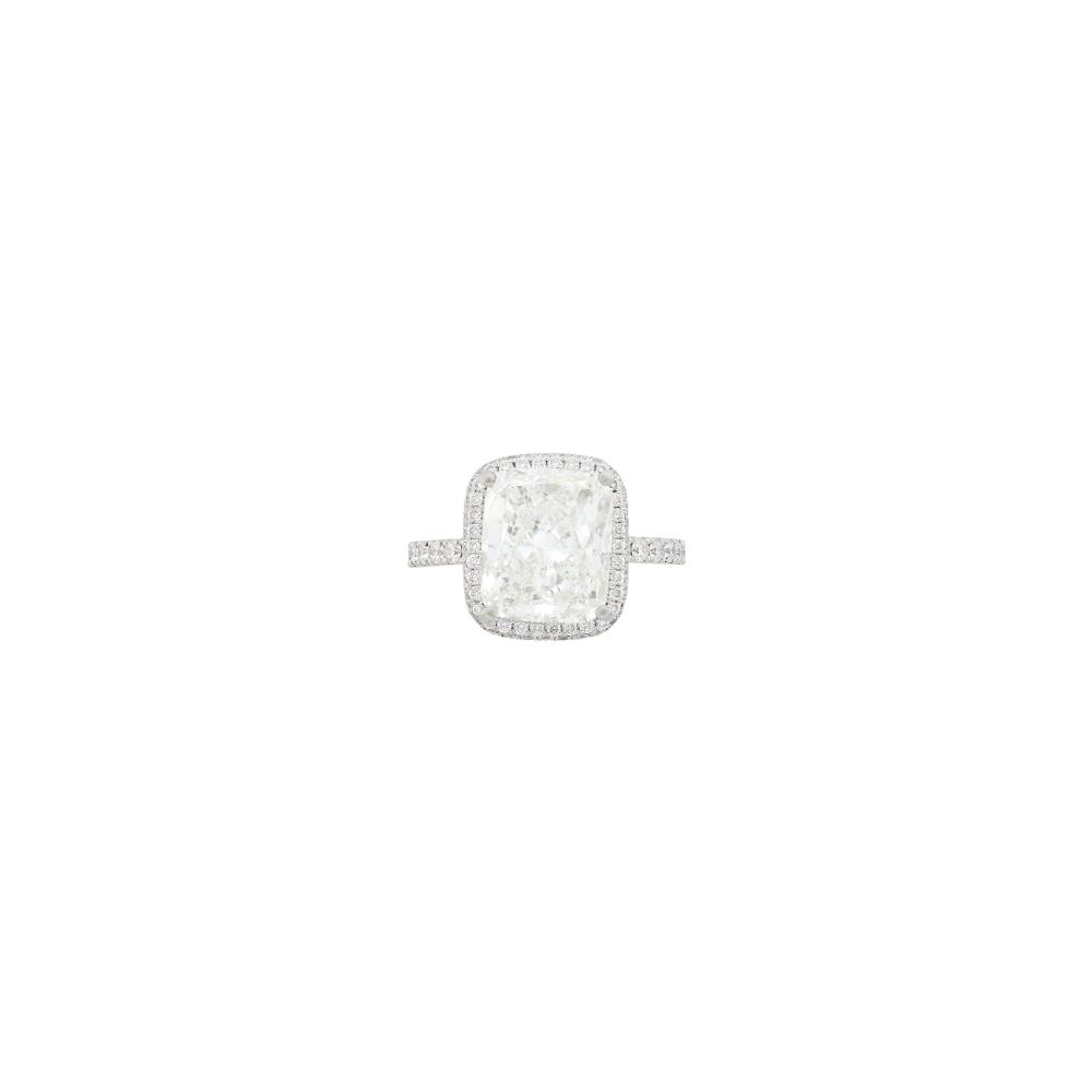 Property from the Collection of a Distinguished Journalist and Bestselling AuthorOne rectangular cushion-shaped modified brilliant diamond weighing 4.51 cts., small round diamonds. Size 5.
 
With GIA report no. 6237867299 stating J color, VS1 clarity.

Diamond: J-VS1, strong blue fluorescence, brilliant.Diamonds: G-H-I-VS, diamonds set on basket and 3/4 down shank.Width 1/2 inch.                            
Any condition statement is given as a courtesy to a client, is an opinion and should not be treated as a statement of fact and our Organization shall have no responsibility for any error or omission. Please contact the specialist department to request further information or additional images that may be available.