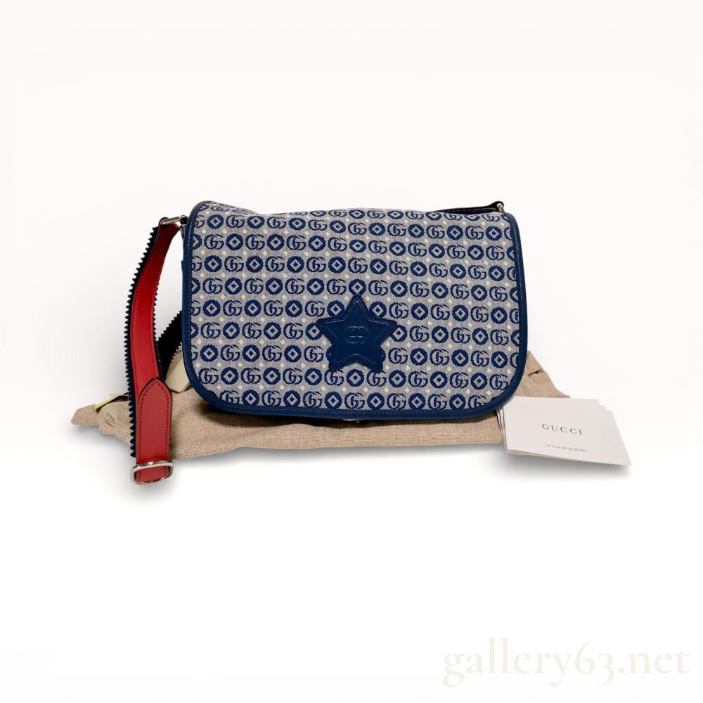 Description
Authentic Gucci messenger bag featuring navy GG monogram canvas throughout. Front accented with an applied leather star motif. Zip-top closure opening to a fabric-lined interior with Gucci label present. Adjustable leather shoulder strap in contrasting tones with metal hardware. Clean rectangular profile associated with contemporary Gucci casual designs.