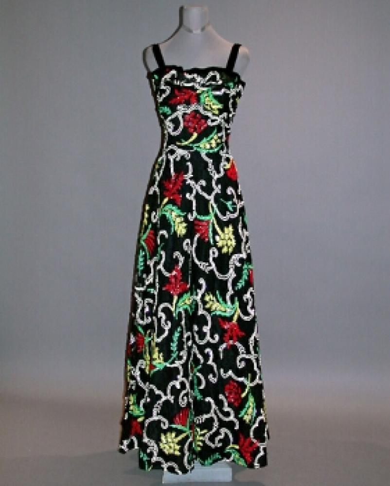 Sequin and Black Lace Evening Gown

Lot 515
Sequin and Black Lace Evening Gown
 French, 1930s 
 With bare camisole bodice, full skirt, black lace embroidered allover with micro sequins in polychrome floral pattern with white volutes, size 10. 
Very good condition, minor tear in lace, possibly shortened.