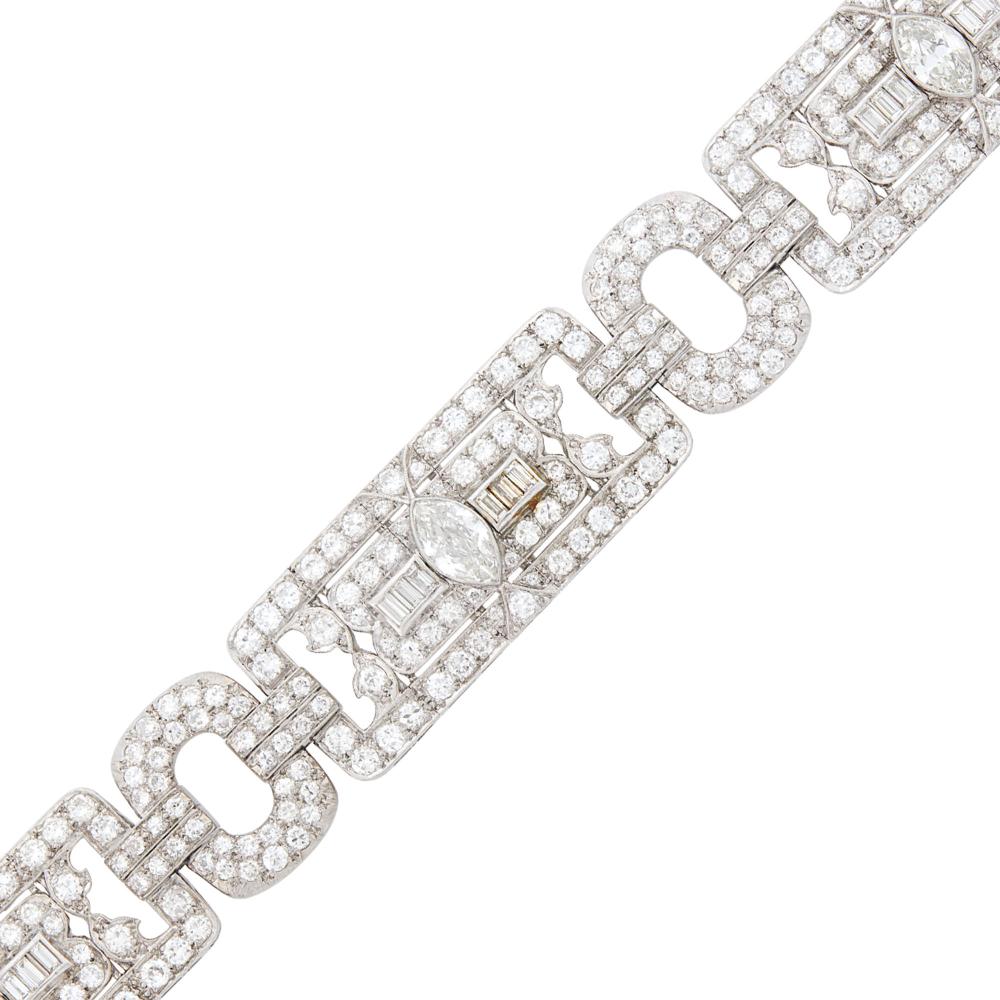 3 marquise diamonds ap. 2.25 cts., 288 old European and transitional-cut and 18 baguette diamonds ap. 12.70 cts., ap. 30.4 dwts. Length 6 3/4 inches.

Marquise diamonds: I-J-VS-SI, faint to no fluorescence.Diamonds:G-H-I-VS, several SI.Width 3/4 inch.                            
Any condition statement is given as a courtesy to a client, is an opinion and should not be treated as a statement of fact and our Organization shall have no responsibility for any error or omission. Please contact the specialist department to request further information or additional images that may be available.
