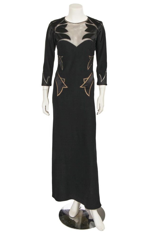 An Alexander McQueen black satin and crêpe evening dress, commercial collection 2007

An Alexander McQueen black satin and crêpe evening dress, commercial collection 2007

labelled, with angular satin appliqués to black mesh illusion neckline and sides of dress, with elbow-length sleeves, integral nude under-slip, bust 86cm, 34in; together with an Alexander McQueen by Sarah Burton black brocatelle jacket, woven with roses, double-breasted with wide bell sleeves, labelled, bust 86cm, 34in (2)

Share this lot: