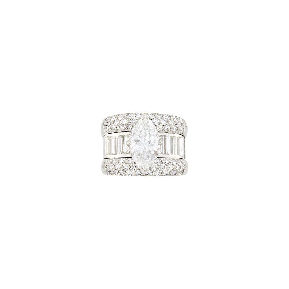 From the Estate of a Lovely LadyOne marquise-shaped diamond weighing 3.31 cts., 60 round and 8 baguette diamonds ap. 3.25 cts., ap. 17 dwts. Size 8 1/4.
 
With GIA report no. 2231896711 stating D color, VS1 clarity.

Center diamond: D-VS1, no fluorescence, very nice shape and cut.Diamonds: G-H-I-VS.Width 5/8 to 1/4 inch.                            
Any condition statement is given as a courtesy to a client, is an opinion and should not be treated as a statement of fact and our Organization shall have no responsibility for any error or omission. Please contact the specialist department to request further information or additional images that may be available.