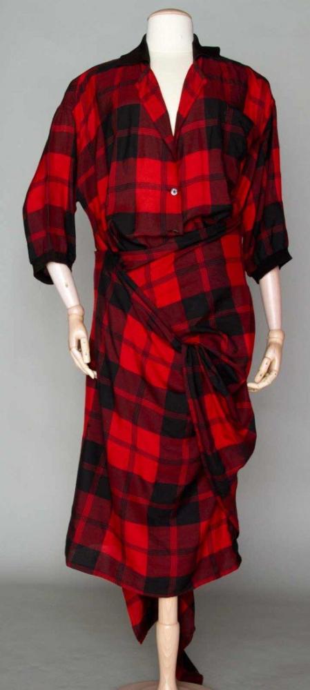 JEAN PAUL GAULTIER DAY DRESS, EARLY 1980s

Cotton/viscose red & black plaid, front buttons, 2 long skirt panels to wrap around hips & legs & tie in numerous styles, IT. Size 42, label "Jean Paul Gaultier pour GIBO", excellent; t/w 1 pair red l