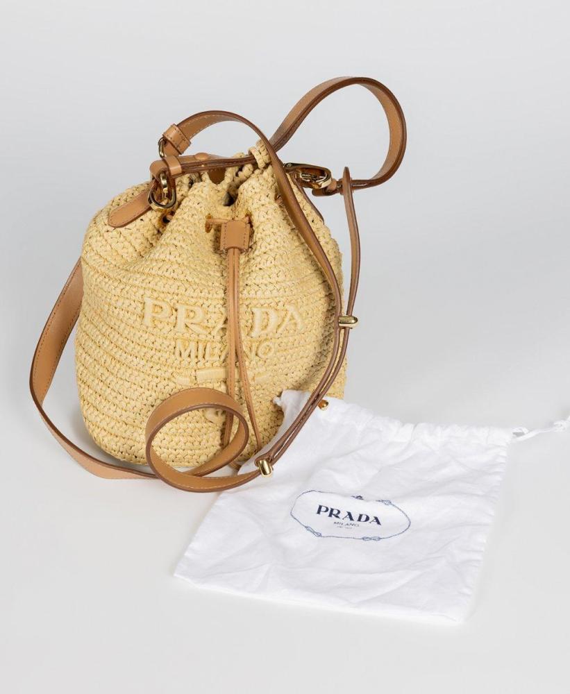 Description

PRADA.
Mini satchel bag.
In crochet and natural brown leather. The embroidered tone-on-tone logo decorates the accessory, which is completed with an adjustable and removable shoulder strap. Features leather drawstring closure and metal hardware.
With dust bag.
Measurements: 17 x 19 x 11 cm.

The mini Prada bag, made of crochet and natural leather, is part of the line of material exploration that the firm has developed in its contemporary collections, where traditional craftsmanship is reinterpreted from a modern and sophisticated point of view. The bag-like format refers to classic leather goods typologies, updated here by means of a light and flexible construction.

With dust bag.