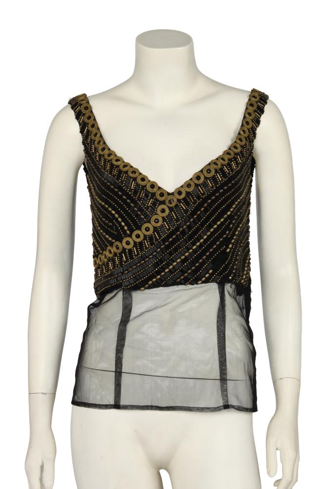 A Gianni Versace haute couture black embellished bodice, ’Altelier Versace’ collection, Autumn-Winter 1989-90

A Gianni Versace haute couture black embellished bodice, ’Altelier Versace’ collection, Autumn-Winter 1989-90

Atelier label, the black tulle ground embroidered with black bugle beads, various brass beads, gilt mesh discs centred with black rhinestones, with extended tulle hem, side zip closure, lined in black crêpe georgette, bust 58.5cm 23in

Share this lot: