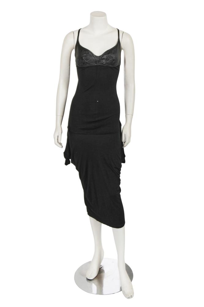 An Alexander McQueen black jersey and leather midi dress, ’Scanners’ collection, Autumn-Winter 2003-04

An Alexander McQueen black jersey and leather midi dress, ’Scanners’ collection, Autumn-Winter 2003-04

labelled, size 46, with moulded leather breast cups, slender straps, sweetheart neckline, the skirt gathered in draped folds to back, asymmetric hem, bust 81cm 32in

Share this lot: