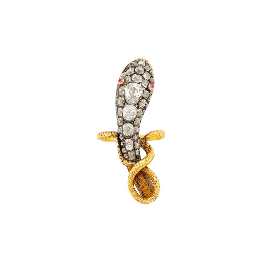 Property from a Prominent Maryland CollectionOne old-mine pear-shaped diamond ap. .50 ct., cushion-shaped old-mine cut diamonds ap. 2.50 cts., small round cabochon ruby eyes, backed by gold, circa 1830, ap. 8.2 dwts. Size 8.

Tests as 18 kt.Diamonds: G-H-I-some J-K-VS-SI.Engraved detail on shank.Width 1 3/4 inches.Evidence of solder repair with crack to gold on reverse.                             
Any condition statement is given as a courtesy to a client, is an opinion and should not be treated as a statement of fact and our Organization shall have no responsibility for any error or omission. Please contact the specialist department to request further information or additional images that may be available.