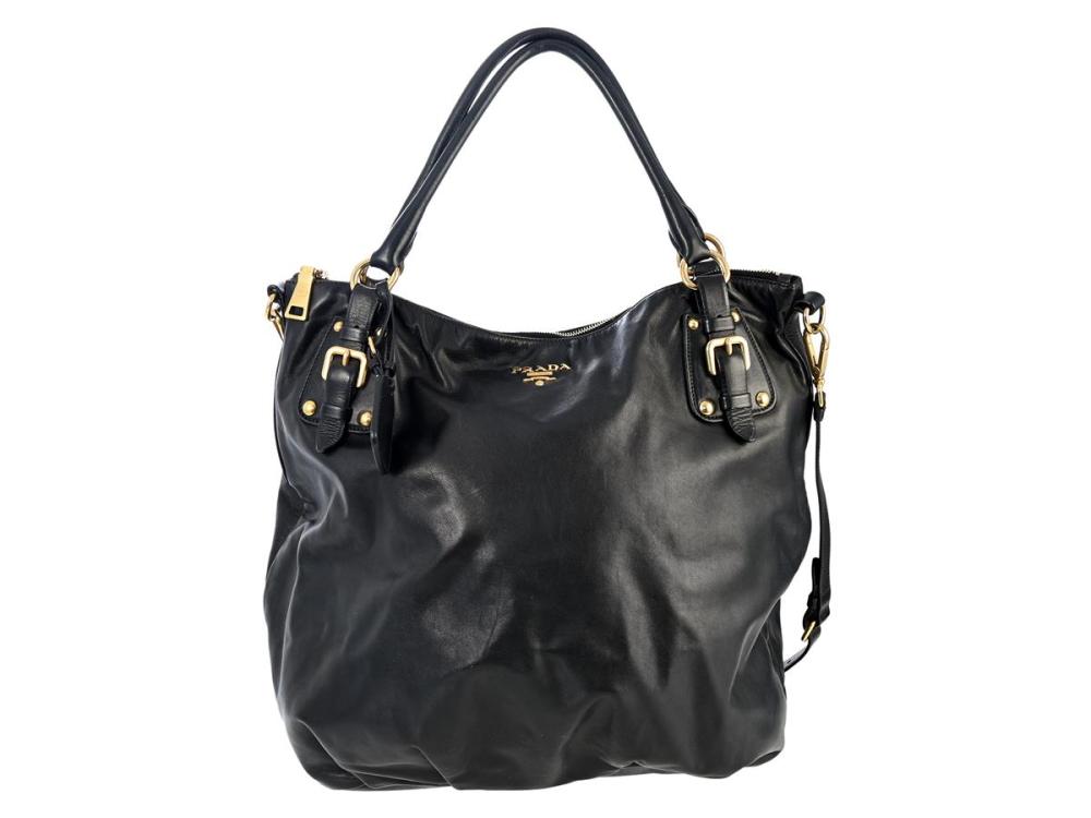 Accessories

Handbags

BAG, PRADA, Hobo Bag, black leather, gold-tone hardware, 35x40x16 cm, detachable shoulder strap, signs of wear.