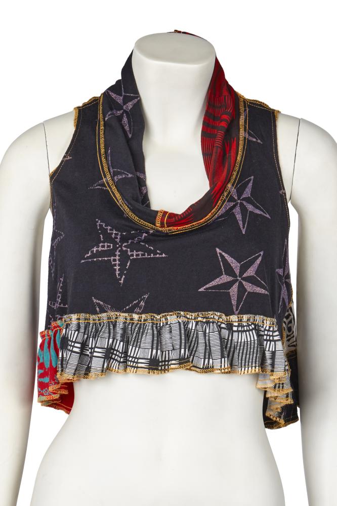 A BodyMap crop top and rare wedged shoes, 1984-85

A BodyMap crop top and rare wedged shoes, 1984-85

the multicoloured cotton jersey crop top, ’Barbee Takes a Trip Around Nature’s Cosmic Curves’ collection, Spring-Summer 1985, printed with various cosmic designs, with ruffled hem, wide neckline, visible seams with contrasting yellow stitching, labelled, bust 107cm 42in; a pair of Goldie Shoe for BodyMap wedges, ‘Cat in the Hat takes a Rumble With a Techno Fish’ collection, Autumn-Winter 1984-85, of black and white leather with ribbed rubber wedge soles, affixed with star tattoo stickers to left toe cap and right upper, contrasting laces, Goldie Shoe label, size 39 (3)

Share this lot: