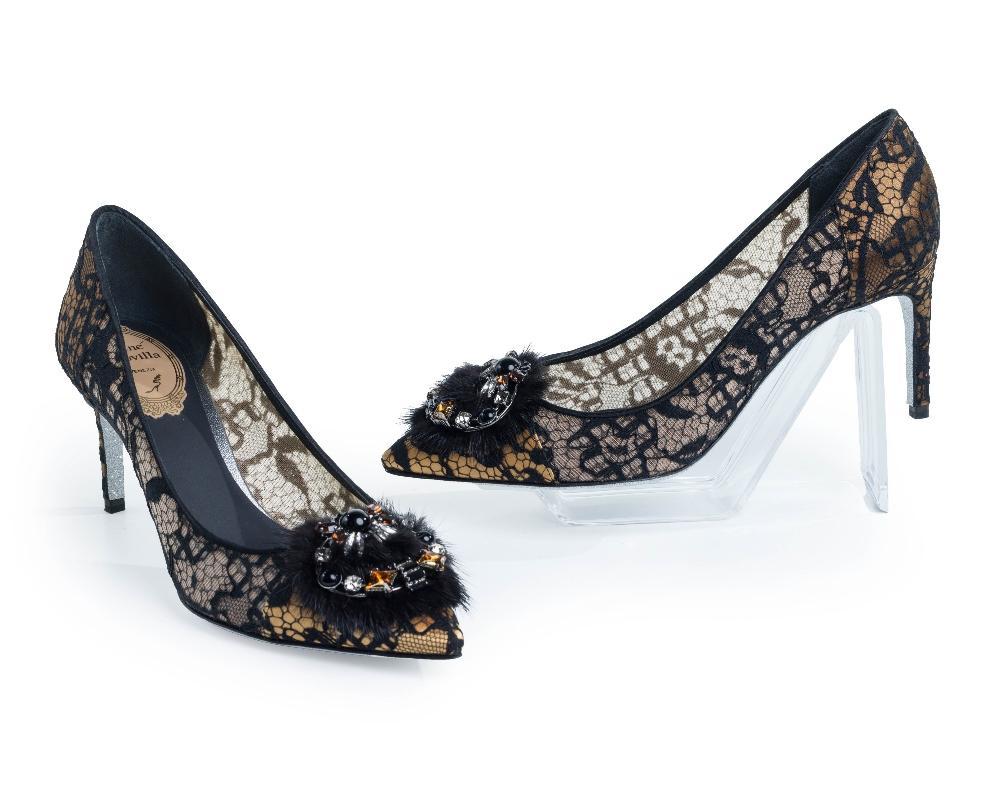 Description
Rene Caovilla.

Decollete’, of beige and black lace exterior detailed with sparkled silver leather sole, further with coloured stones set on mink to the vamp, heel height: 80mm, size 36.5 (UK 3.5), comes with all accessories

Grade A