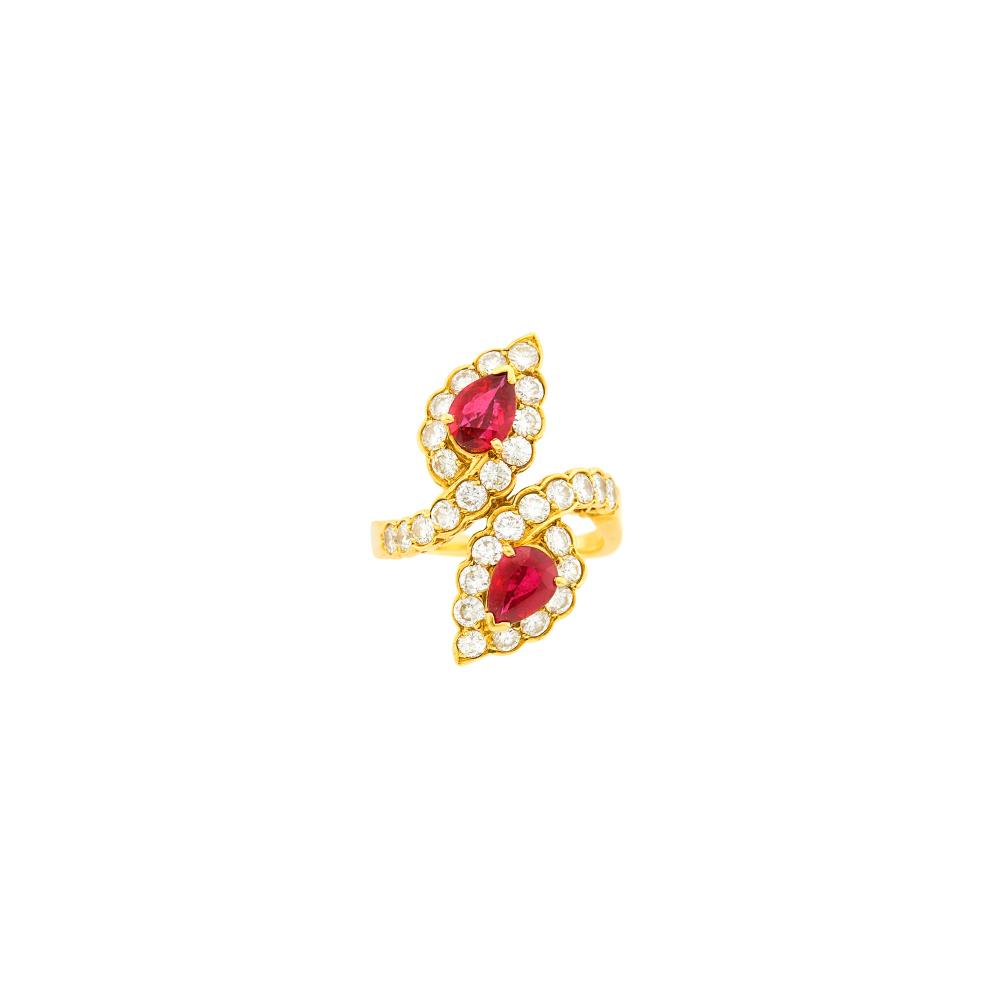 Collection of a Palm Beach Philanthropist18 kt., 2 pear-shaped rubies ap. 1.10 cts., 30 round diamonds ap. 1.35 cts., signed VCA, no. B5148C-41, with maker’s mark and French assay mark, 4.4 dwts. Size 6 1/4.

Rubies: vivid red, slightly included, lively.Diamonds: F-G-H-VS.Width 1 inch.                            
Any condition statement is given as a courtesy to a client, is an opinion and should not be treated as a statement of fact and our Organization shall have no responsibility for any error or omission. Please contact the specialist department to request further information or additional images that may be available.