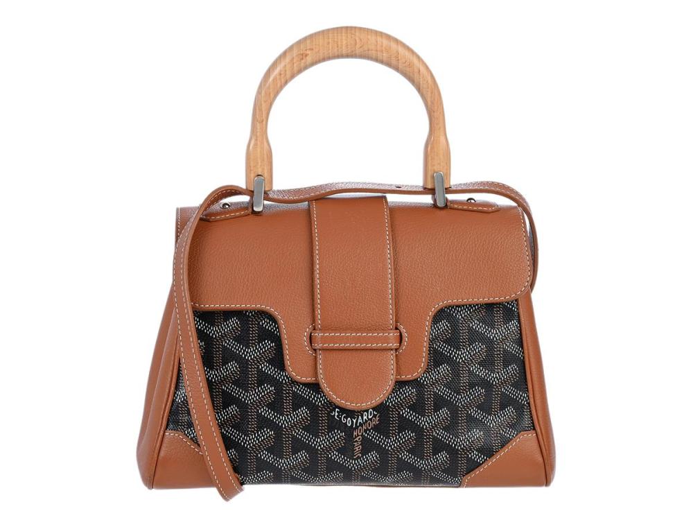 Accessories

Handbags

GOYARD, BAG, Saigon PM, Goyardine Canvas, black, tan, Chevroches calfskin, 20x14x9 cm, detachable shoulder strap. Good Condition.
