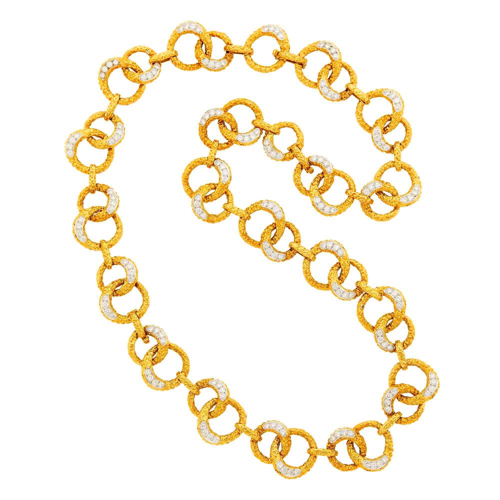 Property of a Distinguished Lady from Athens, Greece18 kt. yellow and white gold, 156 round diamonds ap. 11.40 cts., with obscured maker’s marks and French assay marks, detachable as necklace  of varying lengths and bracelet, ap. 130.6 dwts. Lengths 30, 24, 21 3/8 and 8 inches.

Diamonds: H-I-VS.Link width 15/16 and 13/16 inch.                            
Any condition statement is given as a courtesy to a client, is an opinion and should not be treated as a statement of fact and our Organization shall have no responsibility for any error or omission. Please contact the specialist department to request further information or additional images that may be available.